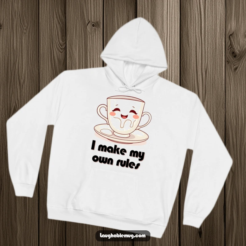 Funny hoodie depicting a cheeky teacup spilling milk onto its saucer, adding a touch of playful chaos.