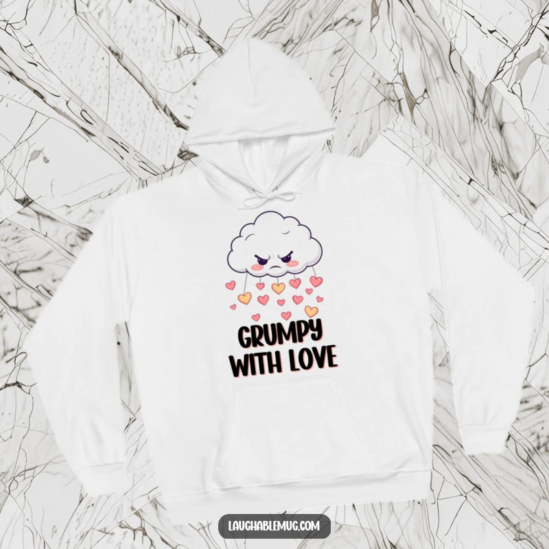 Funny hoodie illustration of a grumpy cloud raining down happy heart-shaped raindrops, embracing emotional complexity.